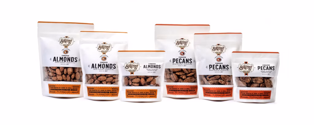 Bags of Scrummy Nuts in a row, in various sizes